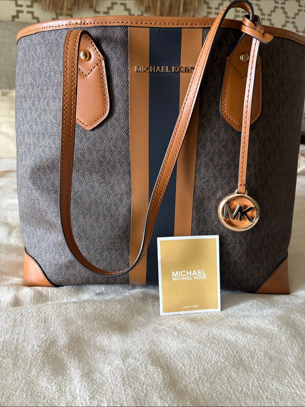Michael Kors Brown and tan tote barely used, excellent condition.